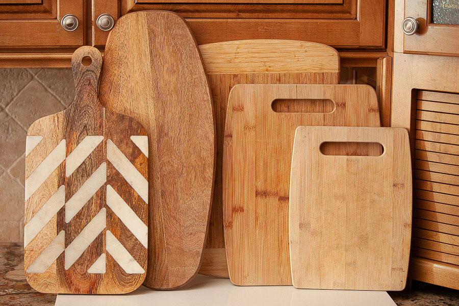 many cutting boards standing upright