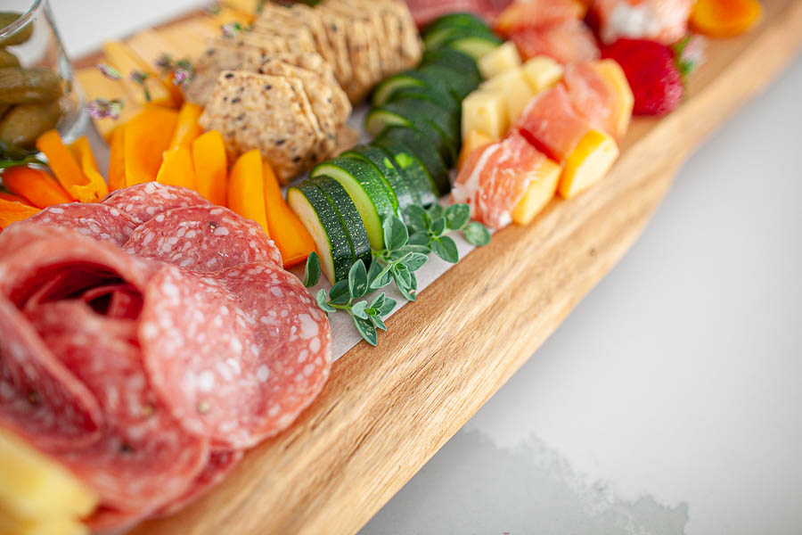 food on a wood charcuterie board